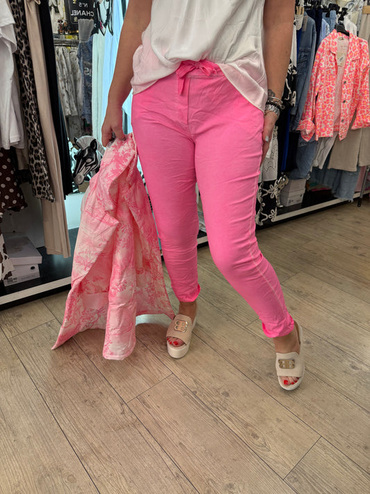 Pantalon magique rose fluo